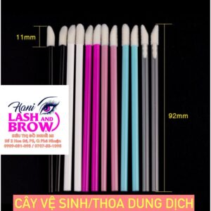 cotton swab applies eyelash conditioner